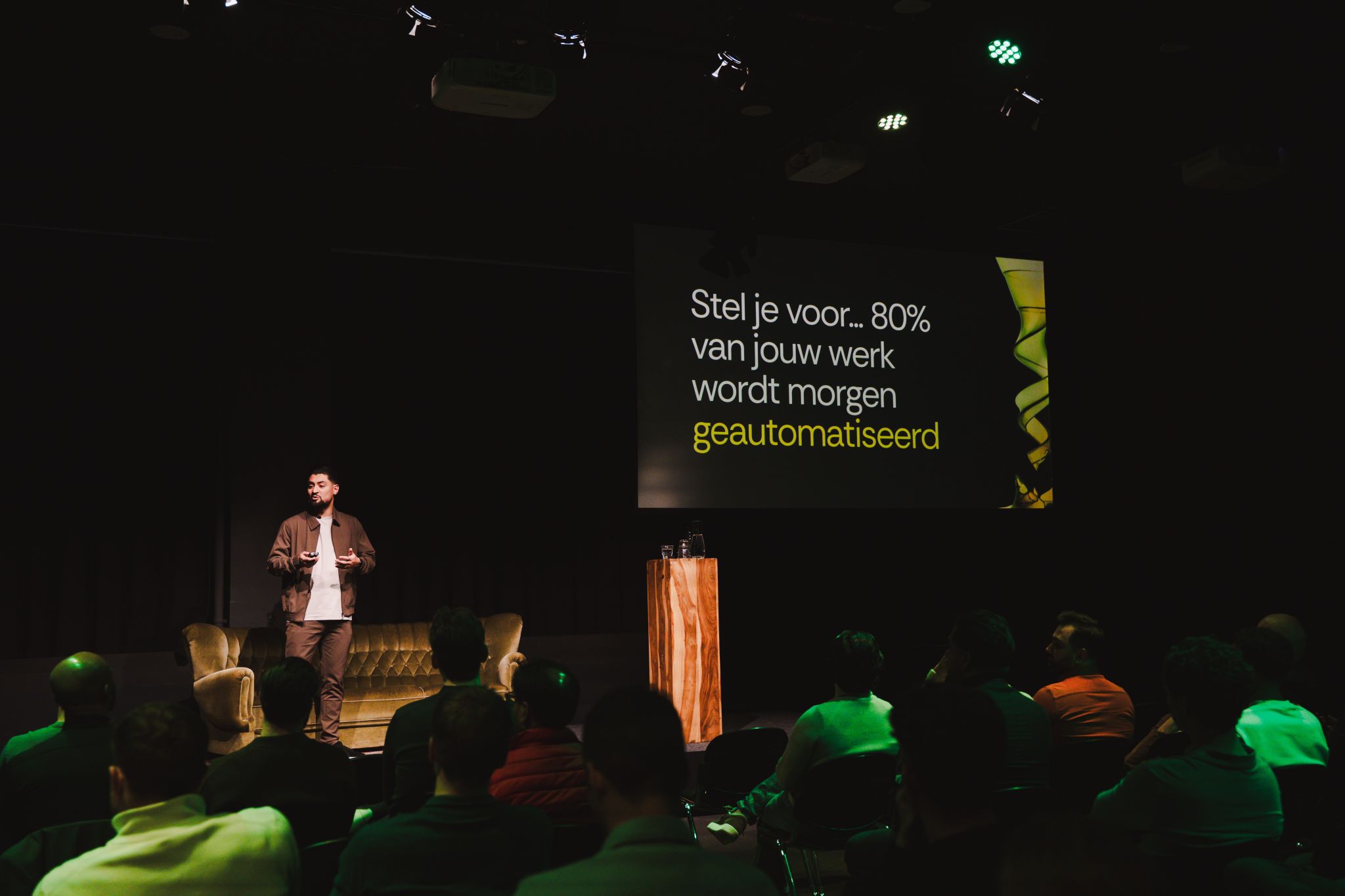 Nawid Sadat on stage at the Re:Shark 2.0 launch, in front of an audience